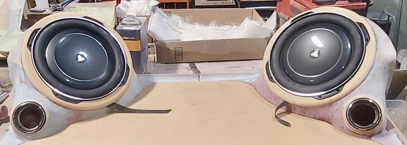 Custom audio enclosures with speakers built and fitted into a classic vehicle interior