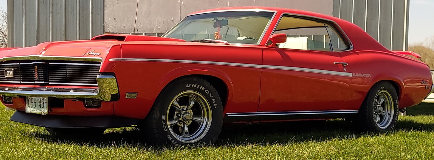 General maintenance work being performed on a classic vehicle in the workshop